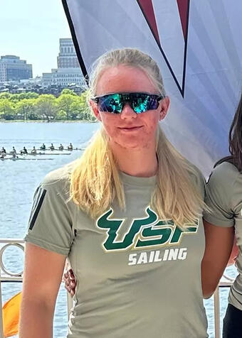 Kay, 23, in a picture with her college team at USF, before going out to dominate the fleet