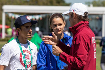 Nico discussing local weather patterns with Olympic Gold Medalist and Mentor Santi Lange at the 2018 Youth Olympic Games