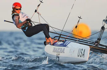 Kay under the orange Omani sun, as she sails to a silver medal at the 2021 Youth World Championships